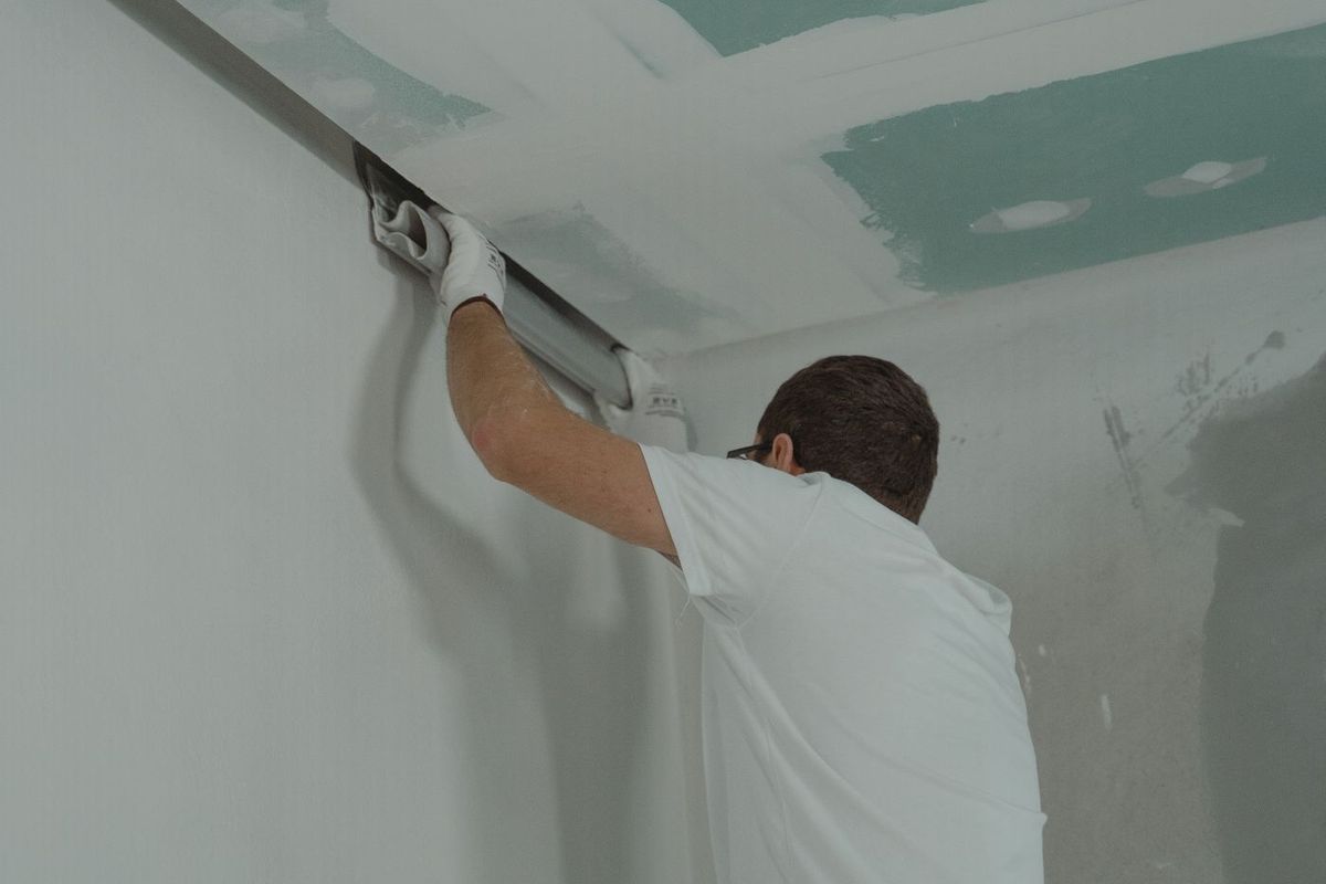 Drywall being installed during a home renovation