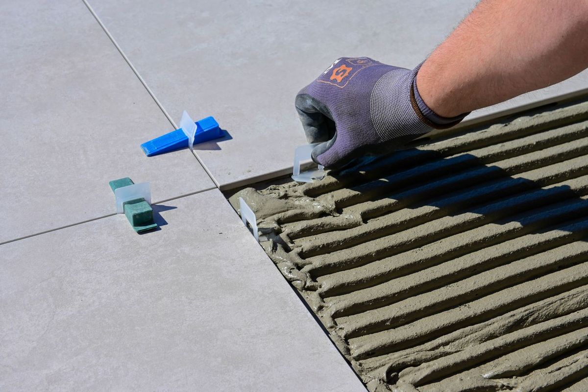 Floor tiles being aligned with spacers